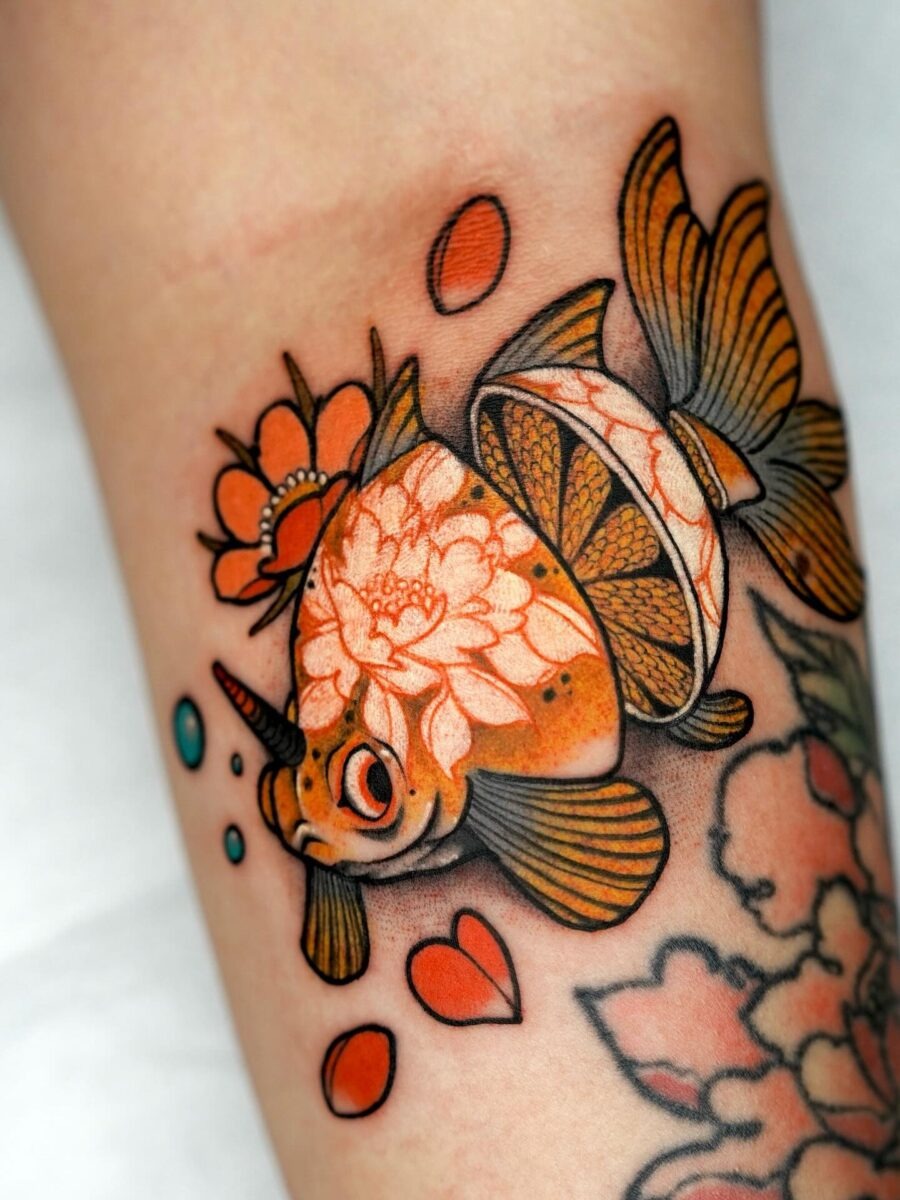 Whimsical goldfish tattoo with floral accents Tattoo Design