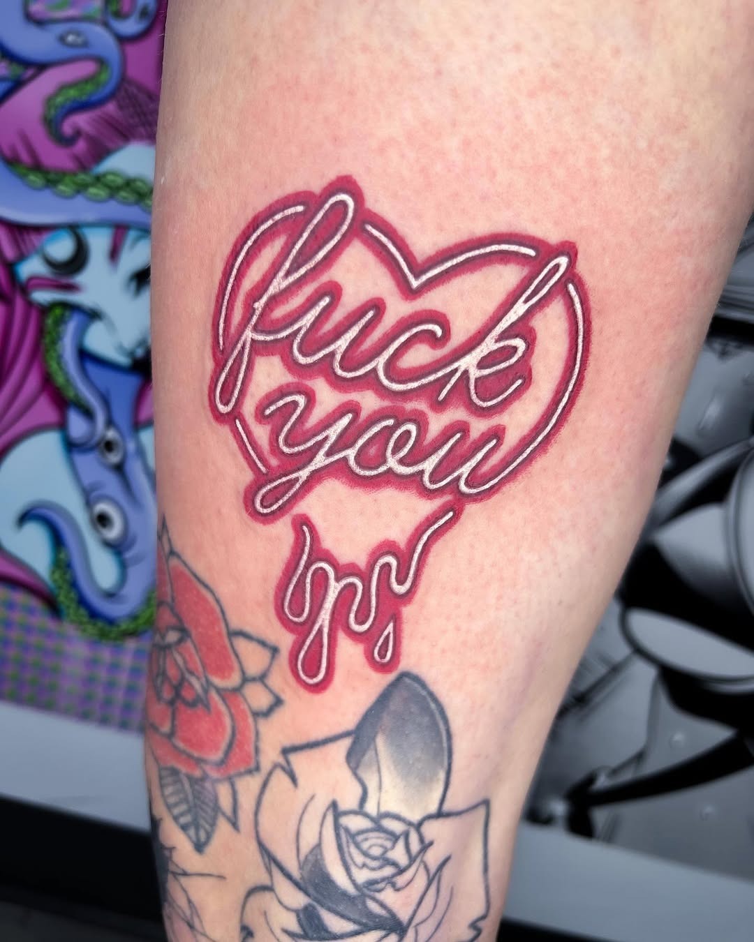 Bold neon heart tattoo with a cheeky phrase Tattoo Design