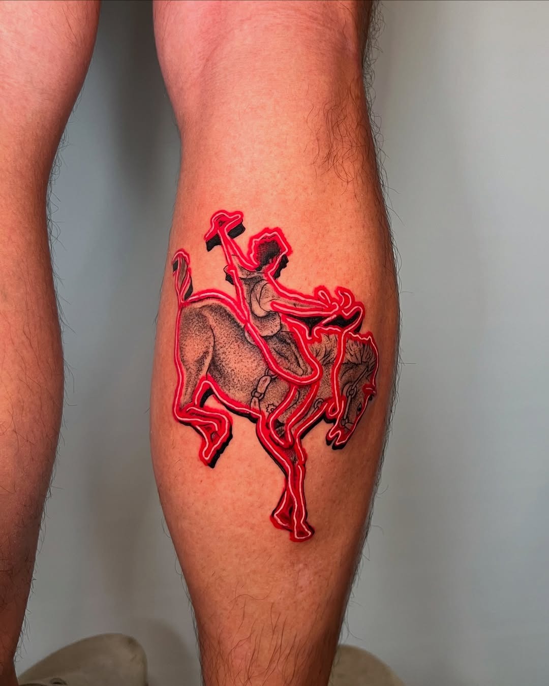 Captivating neon horse rider tattoos on leg. Tattoo Design
