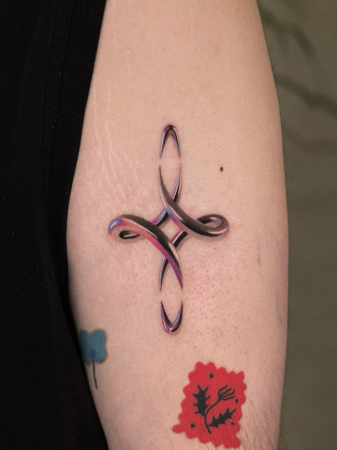 Vibrant and intricate neon tattoo on arm Tattoo Design