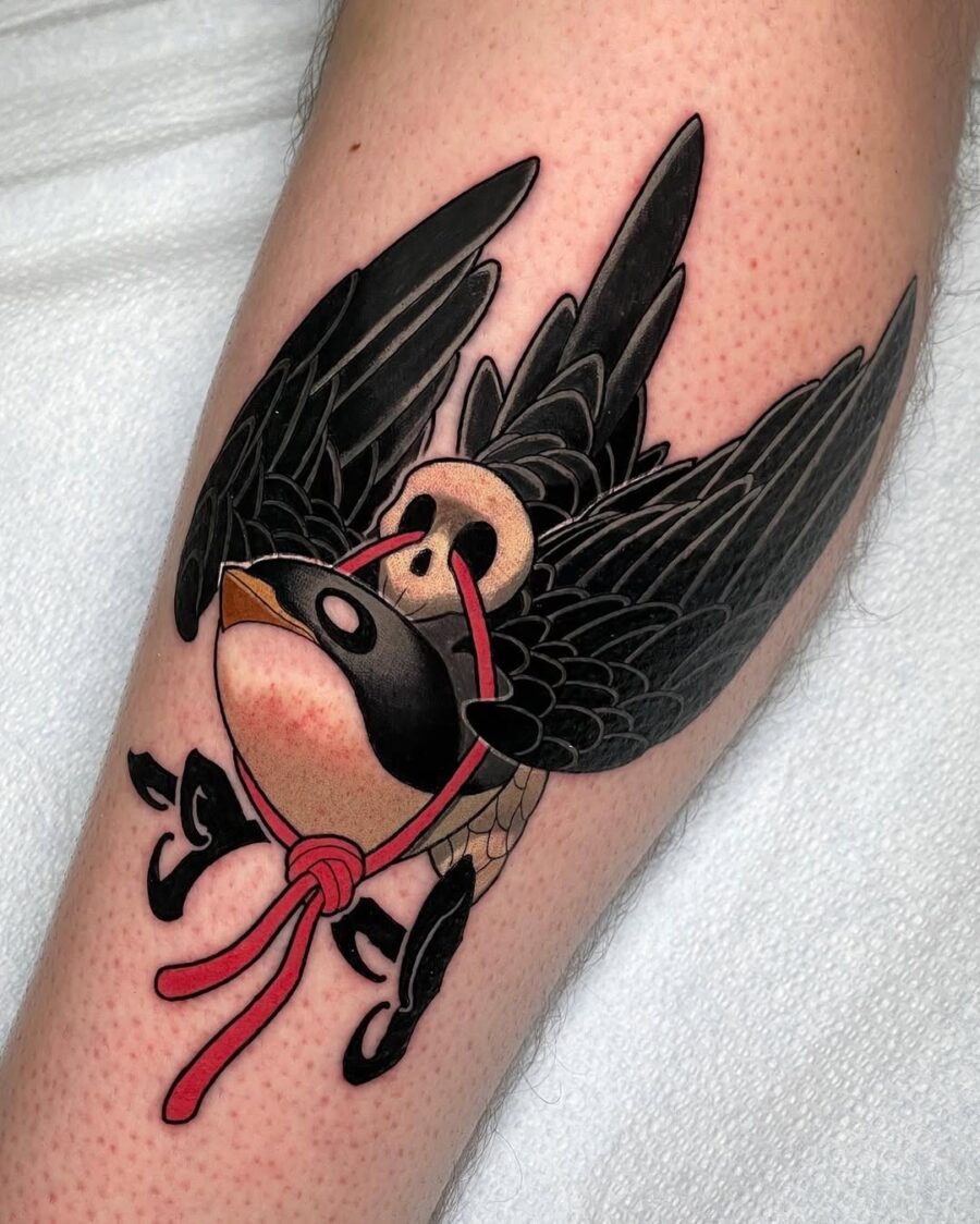 This tattoo features a new school swallow with intricate wing details.
