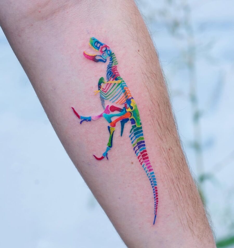 This dinosaur tattoo showcases a unique blend of colors and patterns.