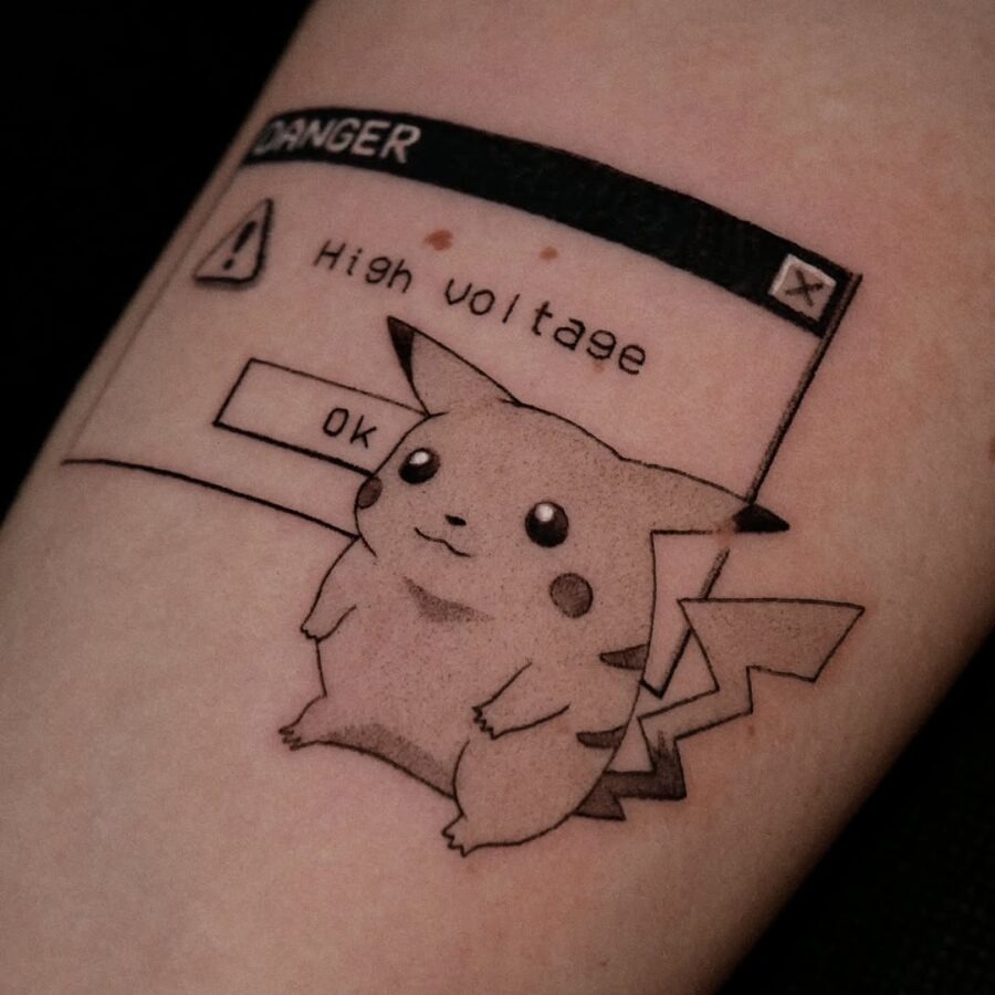 This tattoo features an adorable Pikachu against a vintage computer warning screen.