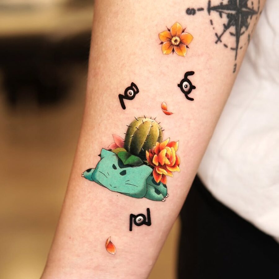 This tattoo showcases a playful Bulbasaur adorned with flowers and a cactus.
