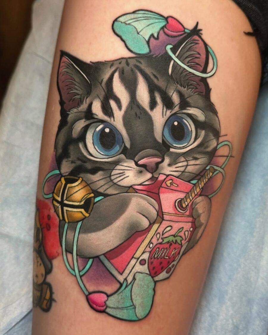 This playful tattoo features an adorable cartoon cat clutching a colorful drink, exuding joy and whimsy.