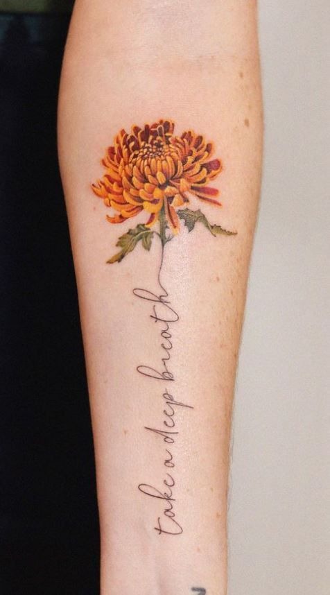 Colorful Chrysanthemum with Script, a tattoo design rendered in clean detailed linework for the hand.