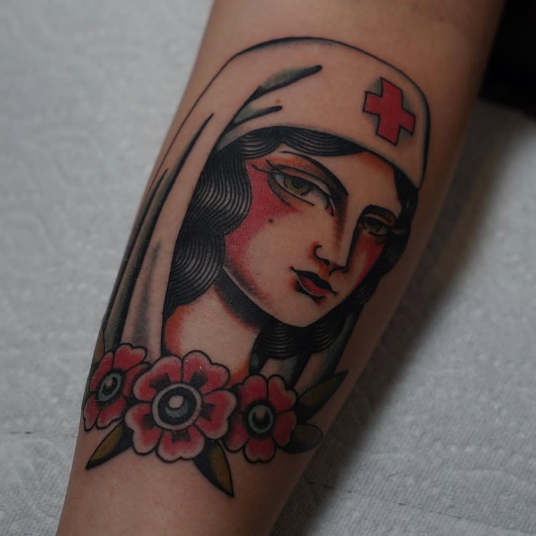 Classic nurse tattoo with a floral twist Tattoo Design
