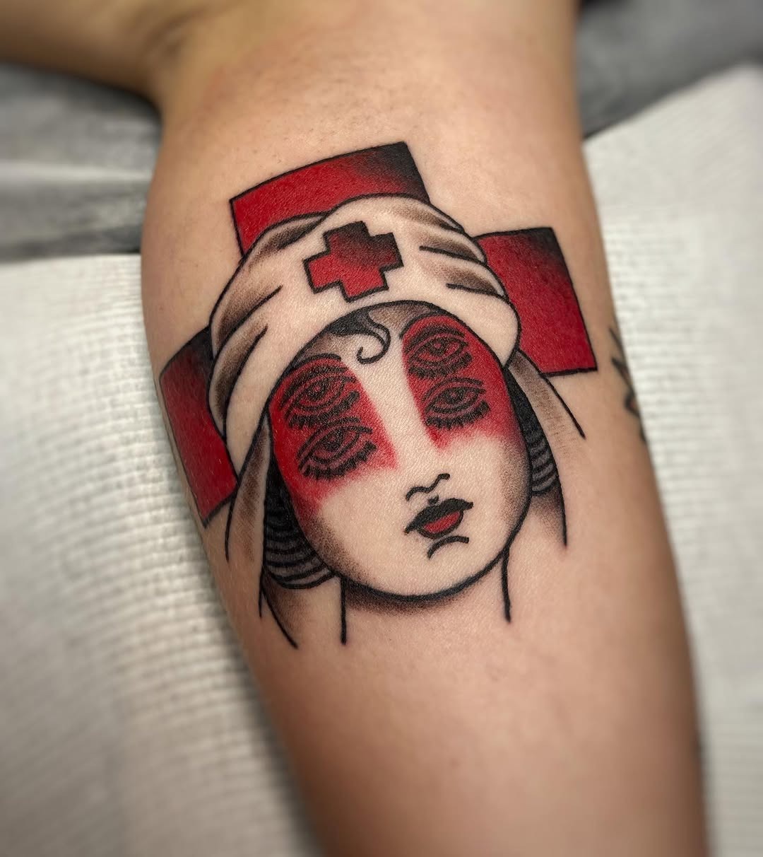 Striking Nurse Tattoo with Red Cross Elements Tattoo Design
