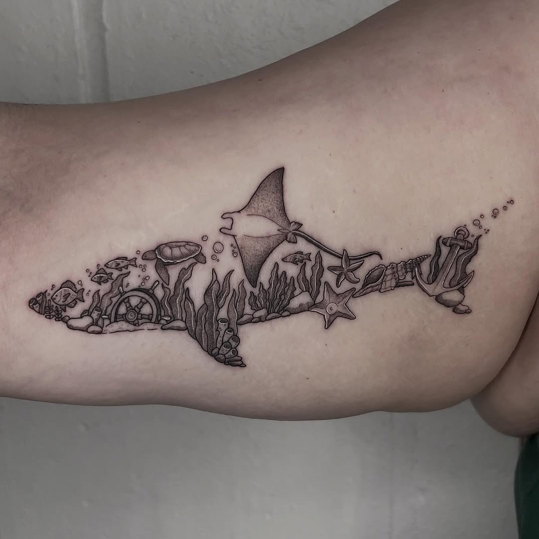 Intricate manta ray tattoo with ocean elements Tattoo Design