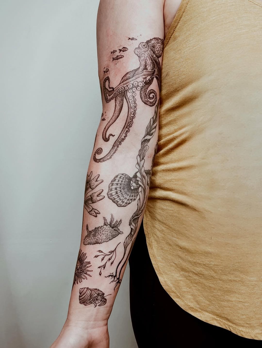 Intricate underwater-themed arm tattoo design Tattoo Design