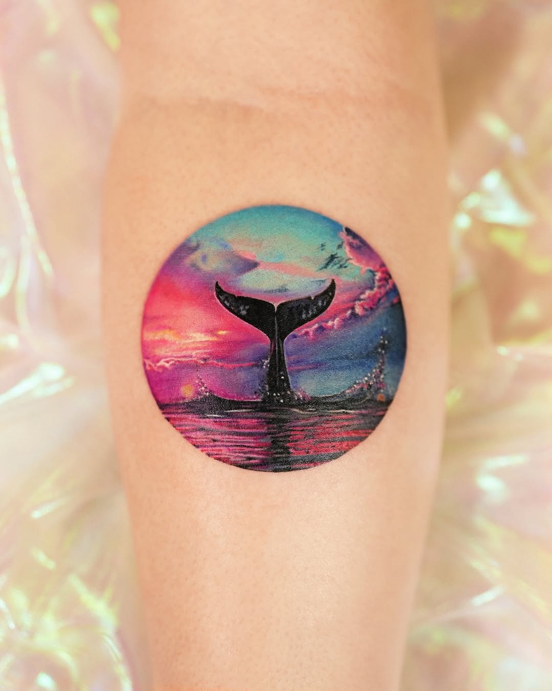 Vibrant Whale Tail Tattoo Against a Dreamy Sky Tattoo Design