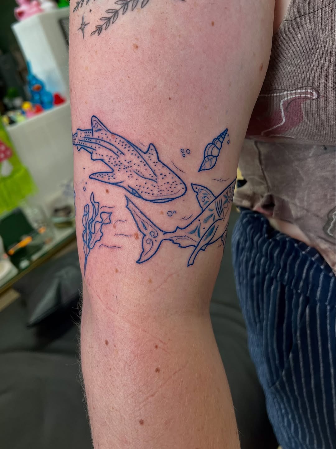 Whimsical ocean-themed shark tattoo design Tattoo Design