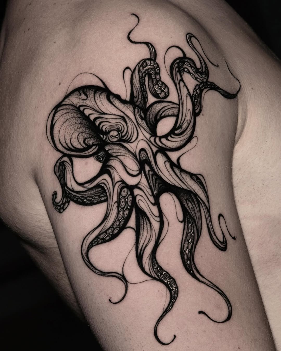 Intricate black ink octopus tattoo on shoulder Tattoo Design