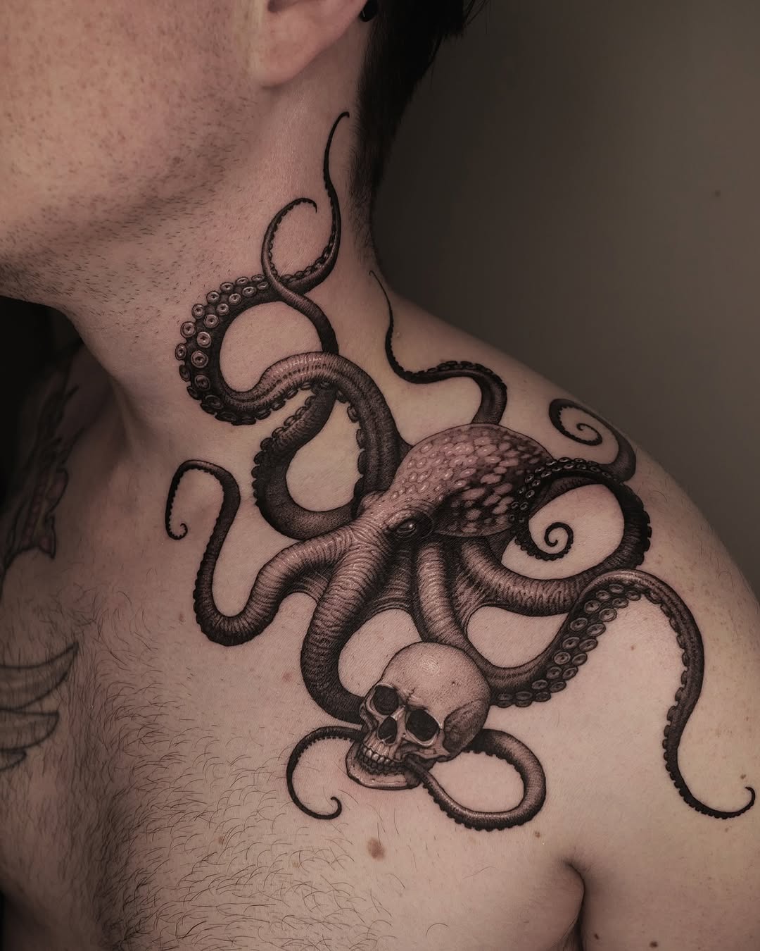 Intricate octopus and skull shoulder tattoo design Tattoo Design