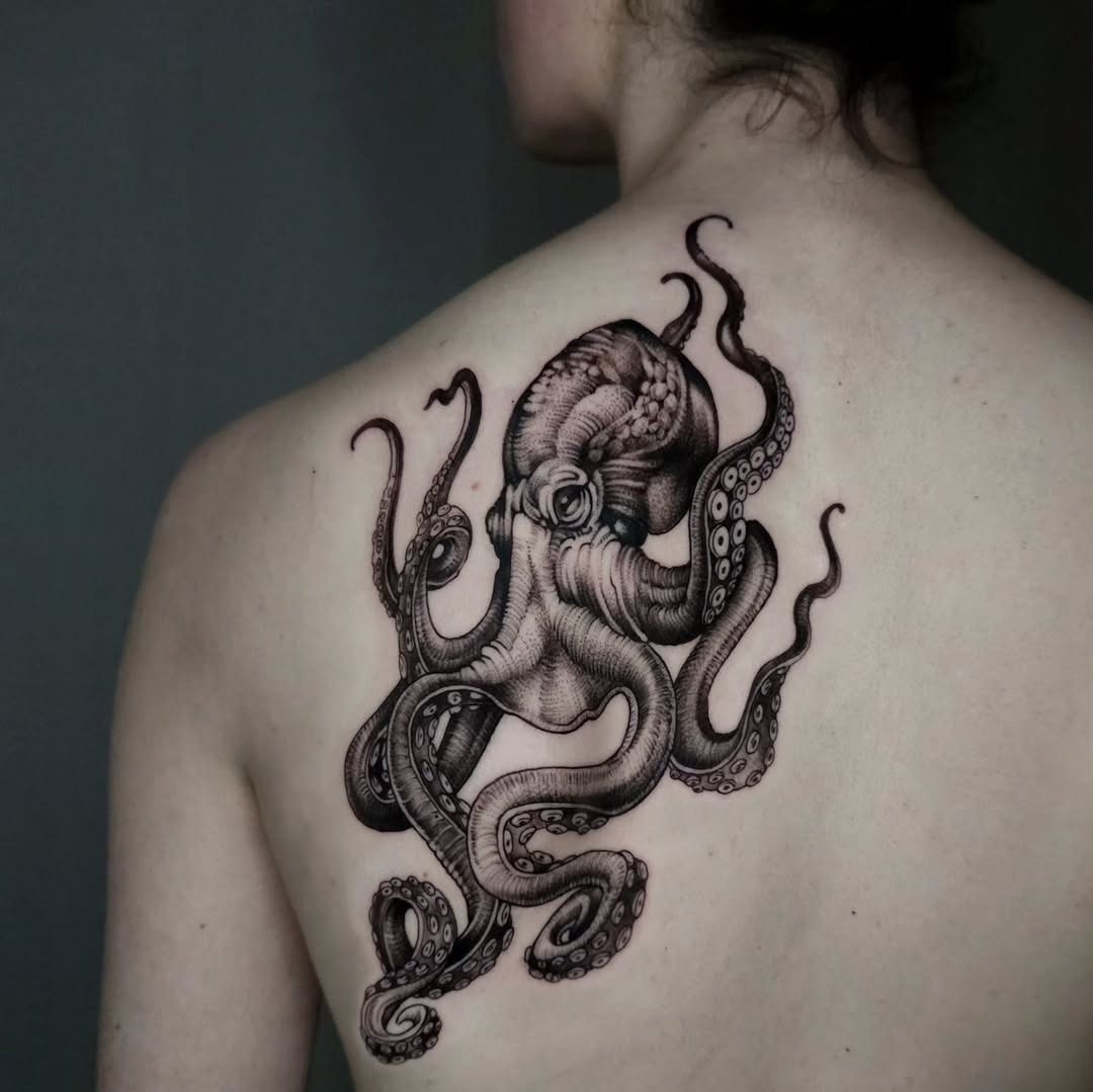 Intricate octopus tattoo on the back Tattoo Design