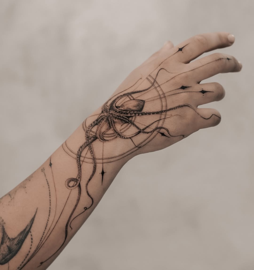 Stunning minimalist octopus tattoo on forearm Tattoo Design