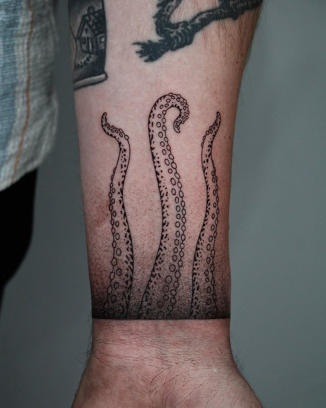 Stunning octopus tentacles tattoo on forearm Tattoo Design