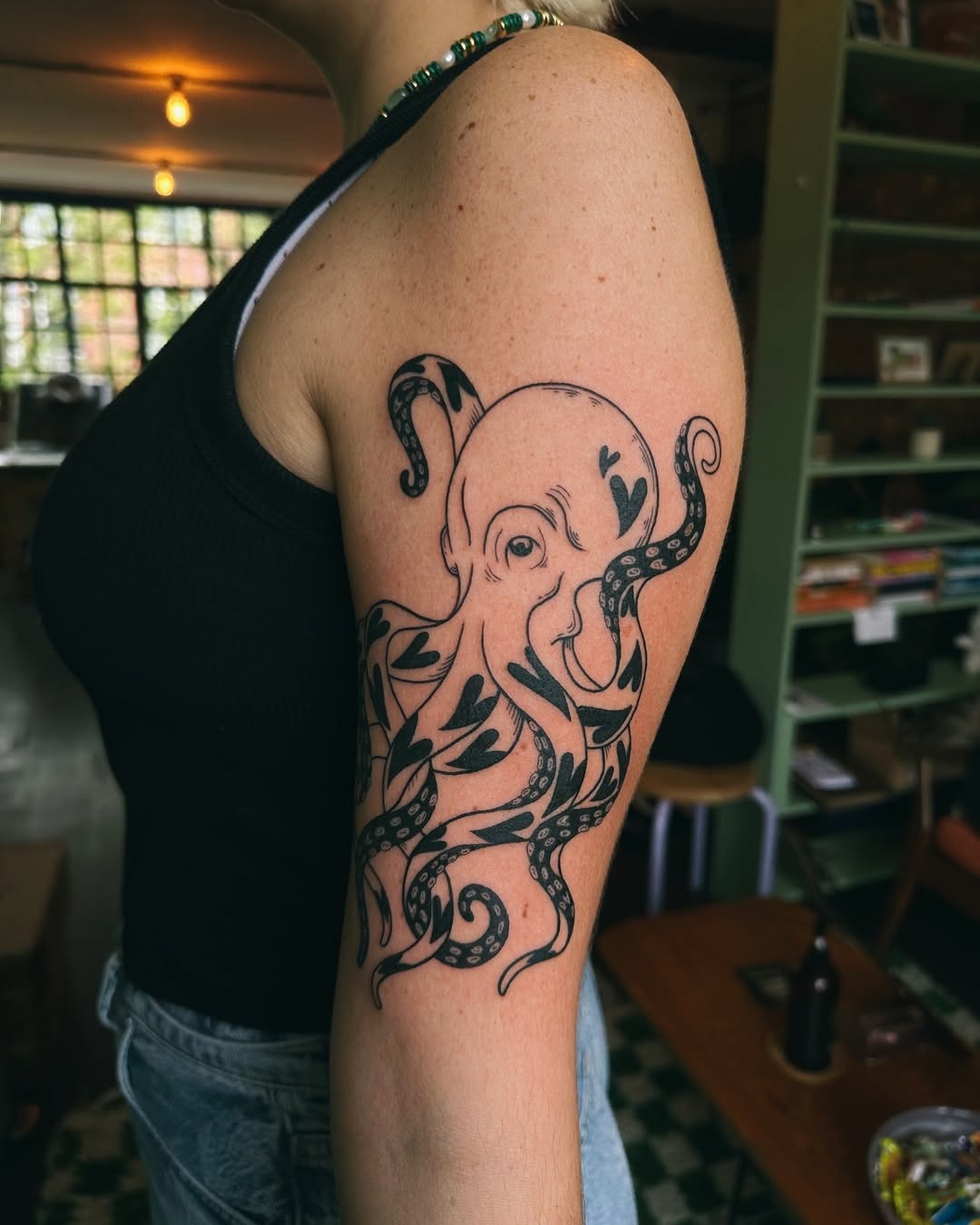 Stylish octopus tattoo with organic elements Tattoo Design