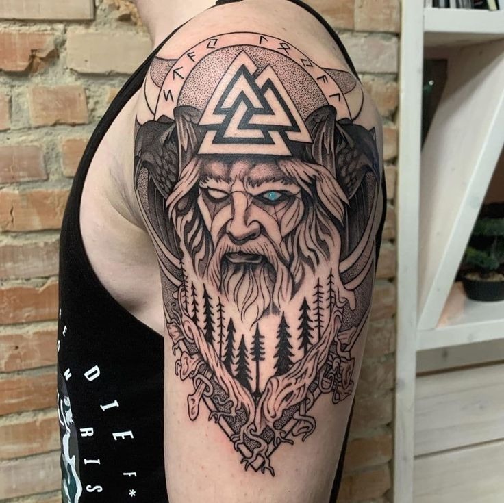 Viking Warrior with Axe and Skulls Tattoo Design