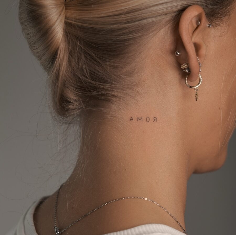 Elegant neck tattoo showcasing the word 'Amor' Tattoo Design