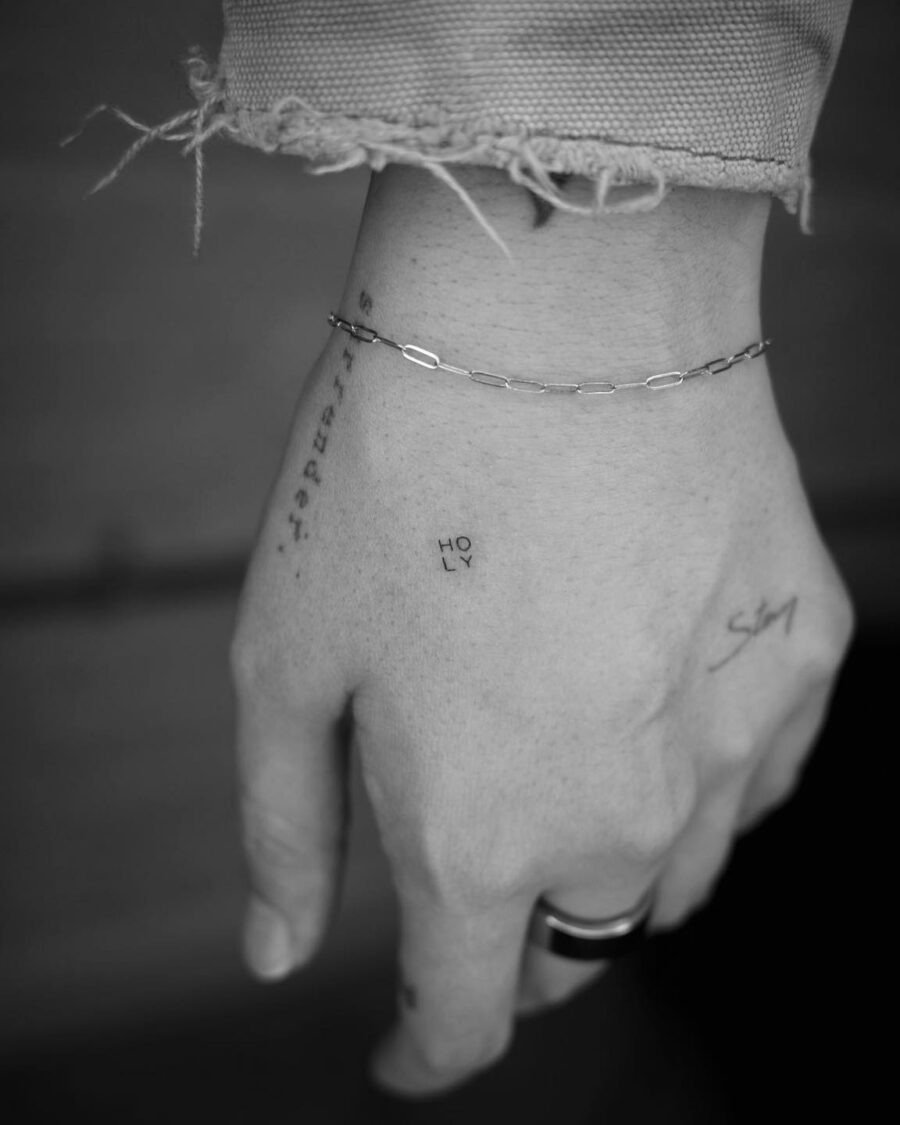 Elegant one-word tattoo in minimal style Tattoo Design