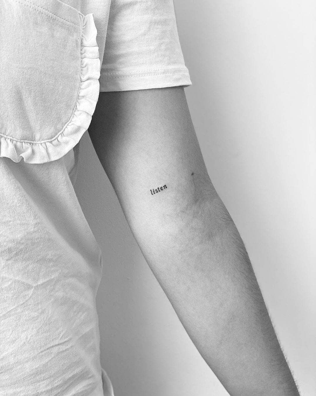 Expressive one-word tattoo: Listen Tattoo Design
