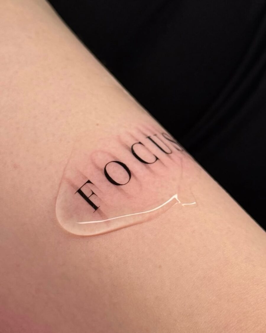 Minimalist 'Focus' Tattoo on Skin Tattoo Design