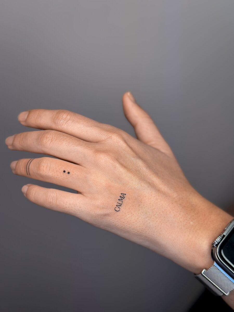 Minimalistic tattoo of the word 'Calma' Tattoo Design