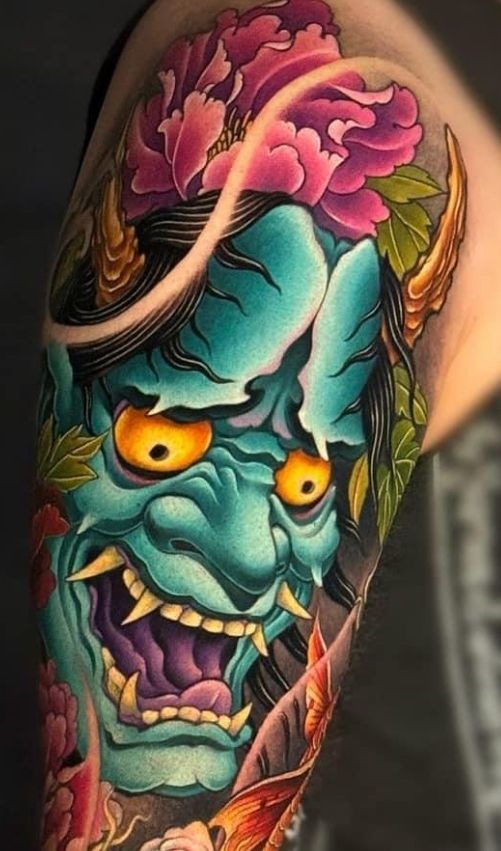Few tattoos capture the clash of elegance and fury like this striking color piece.