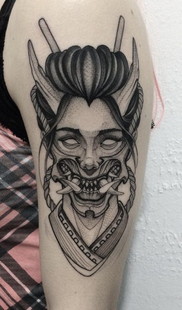 This stylized oni woman tattoo is a fresh take on traditional themes.