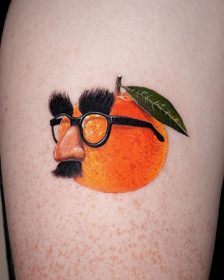 A quirky orange tattoo with personality. Tattoo Design
