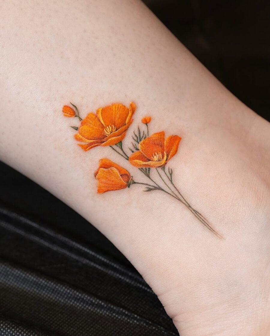 Charming orange floral tattoo on the ankle Tattoo Design