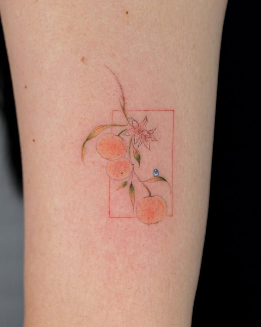 Charming orange tattoo with floral accents Tattoo Design