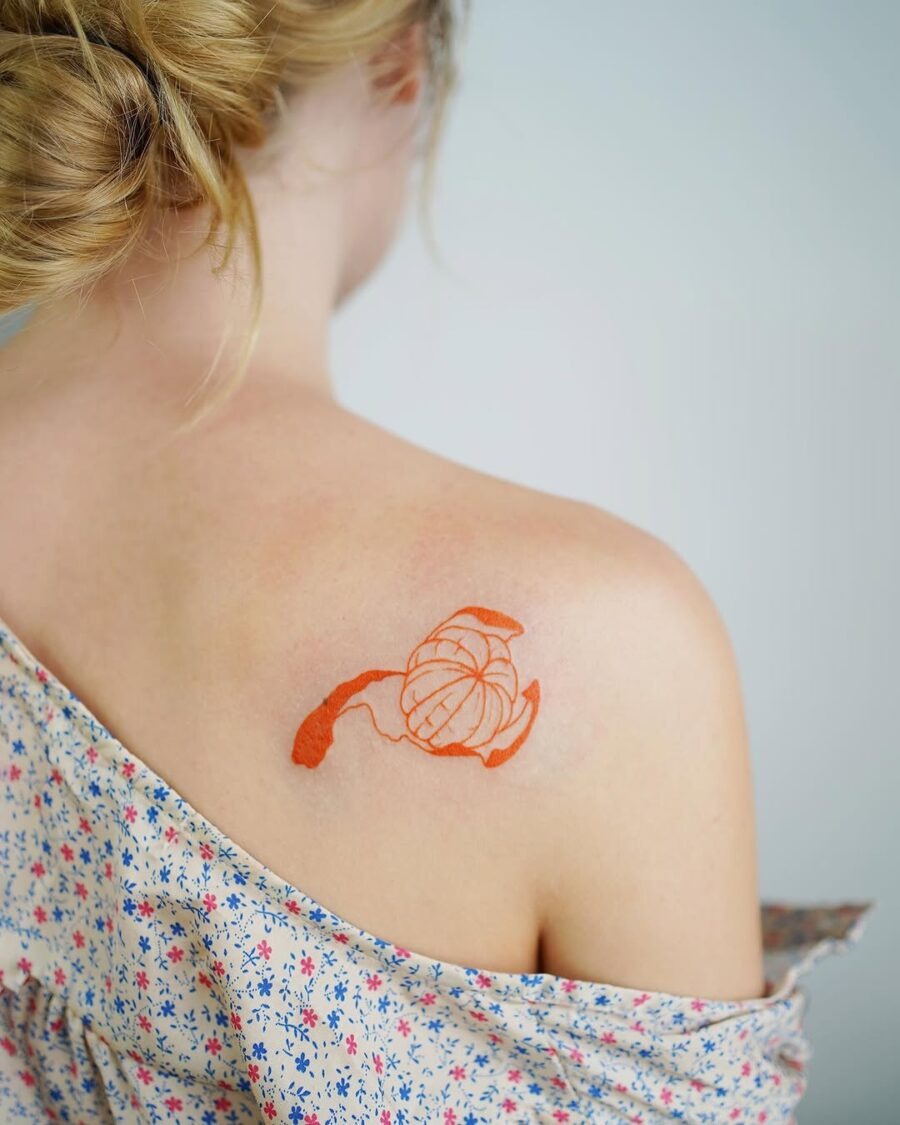 Delicate orange floral tattoo on shoulder Tattoo Design