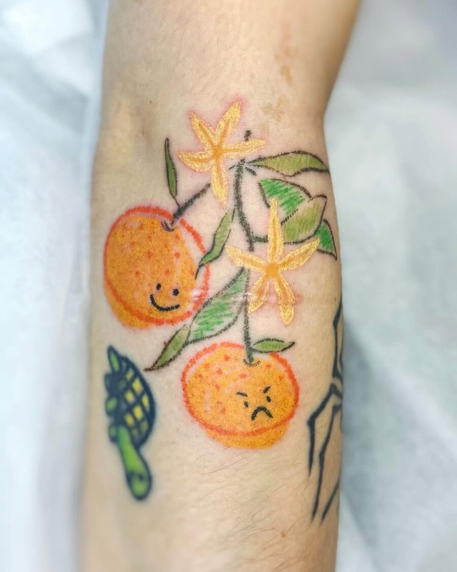 Playful orange tattoos with mixed emotions Tattoo Design