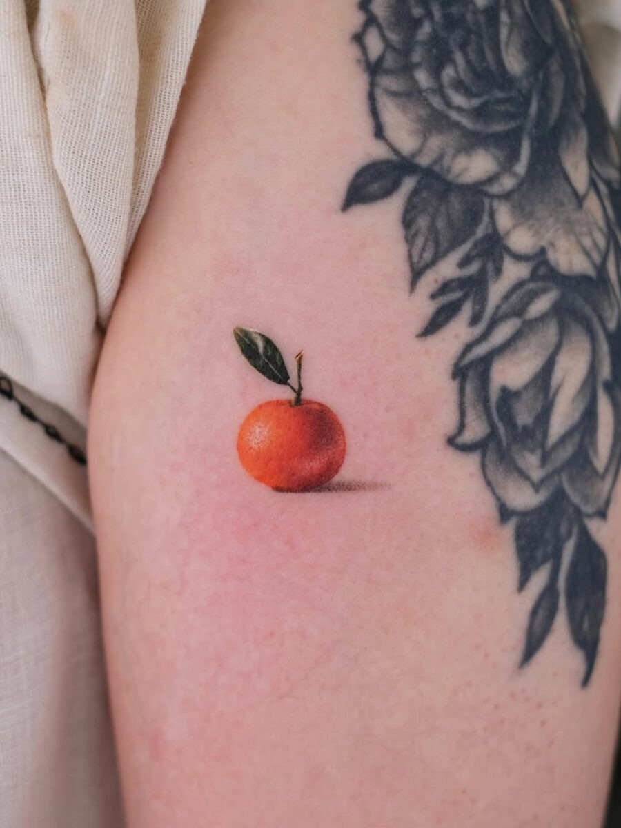 Stunning realistic orange tattoo on skin Tattoo Design