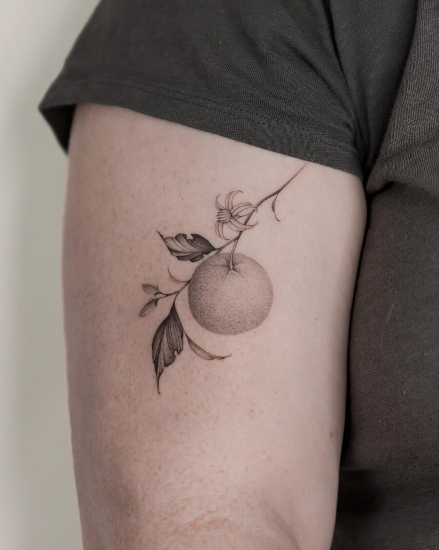 Stylish Orange Tattoo with Floral Accents Tattoo Design