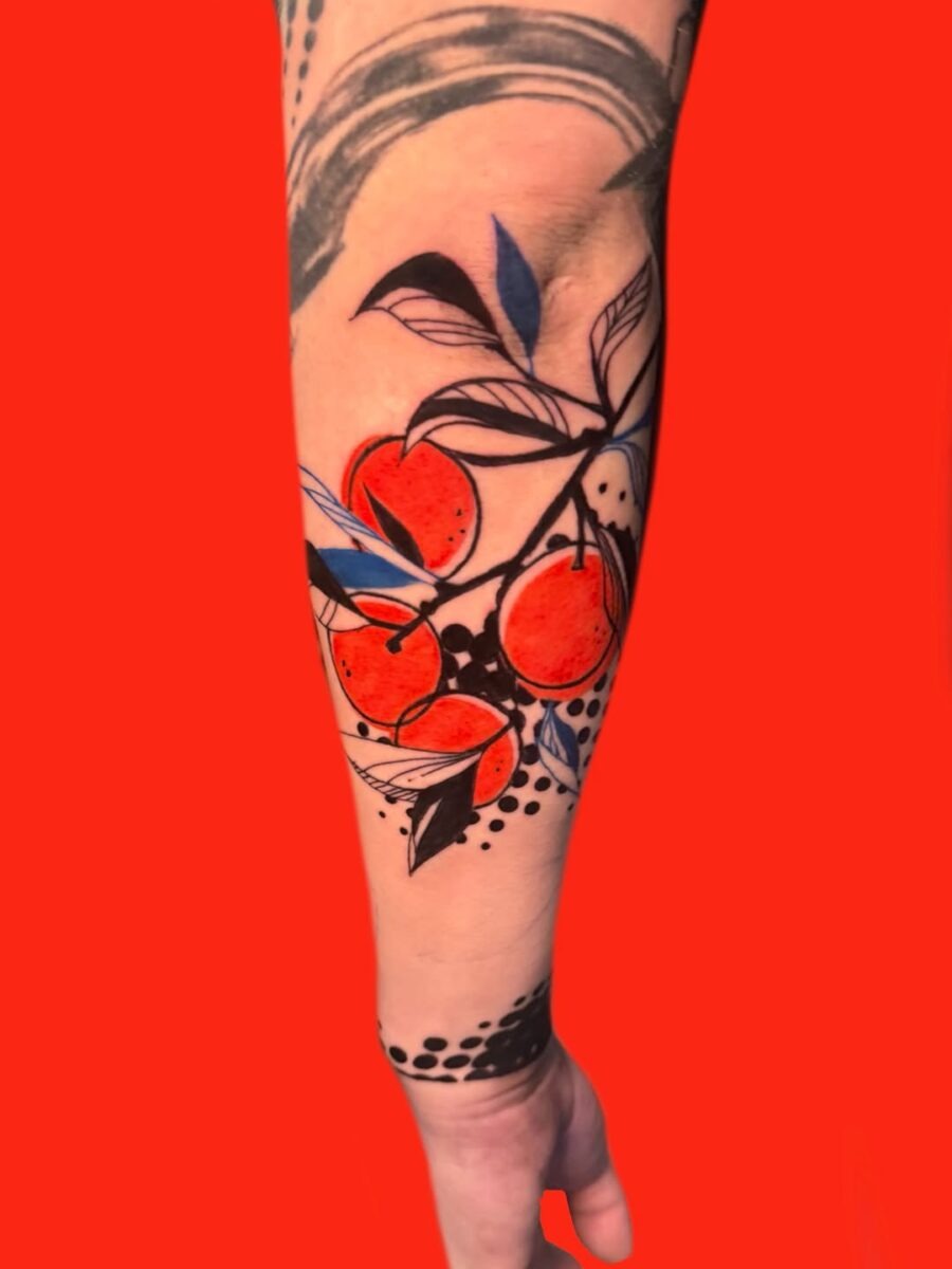 Vibrant orange fruit tattoo with bold foliage Tattoo Design