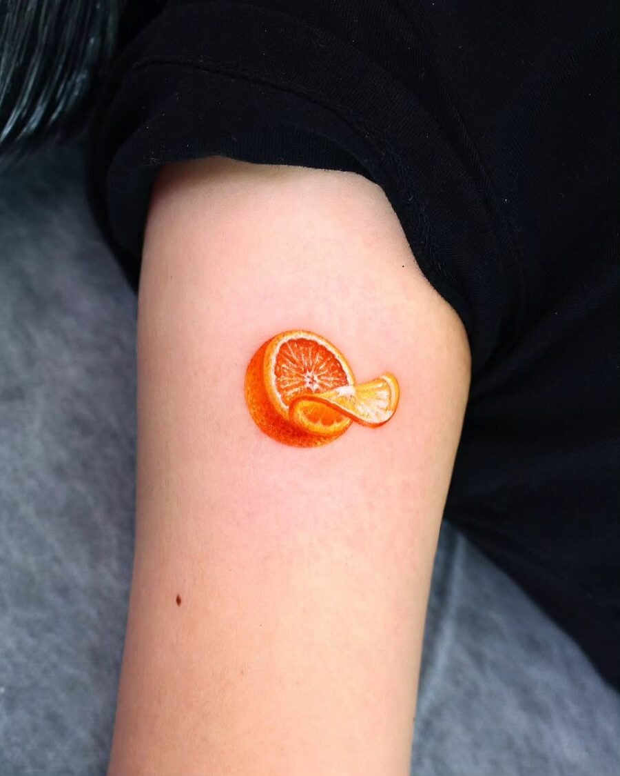 Vibrant orange tattoo with a realistic design Tattoo Design