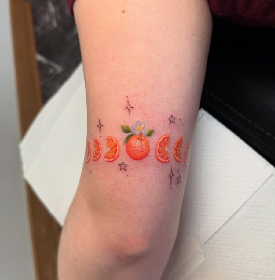 Vibrant Orange Tattoo with Celestial Accents Tattoo Design