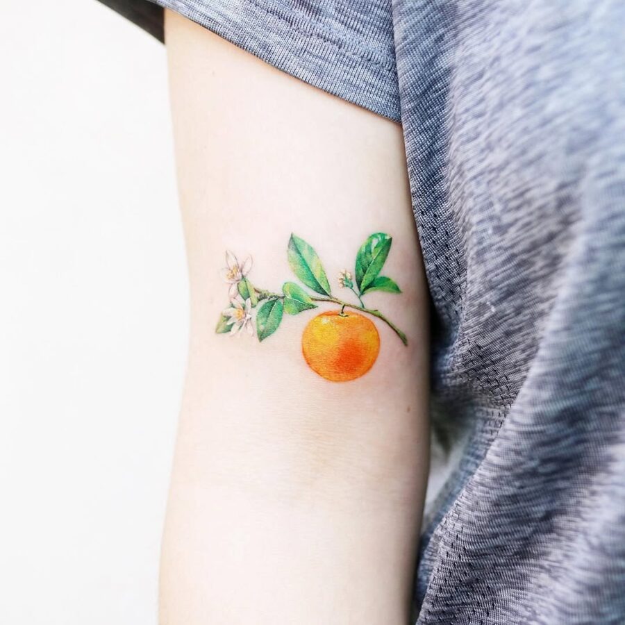 Vibrant orange tattoo with delicate floral accents Tattoo Design