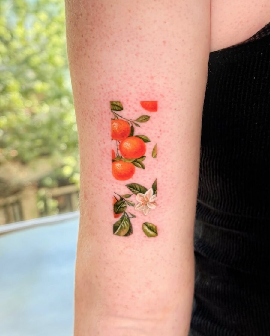 Vibrant orange tattoo with floral accents Tattoo Design