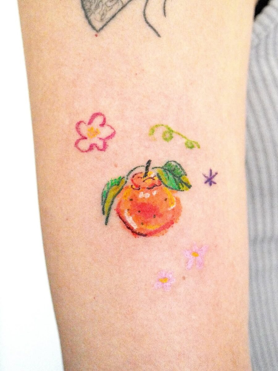Vibrant orange tattoo with floral accents Tattoo Design
