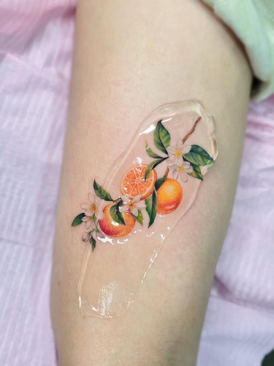 Vibrant Orange Tattoo with Floral Accents Tattoo Design