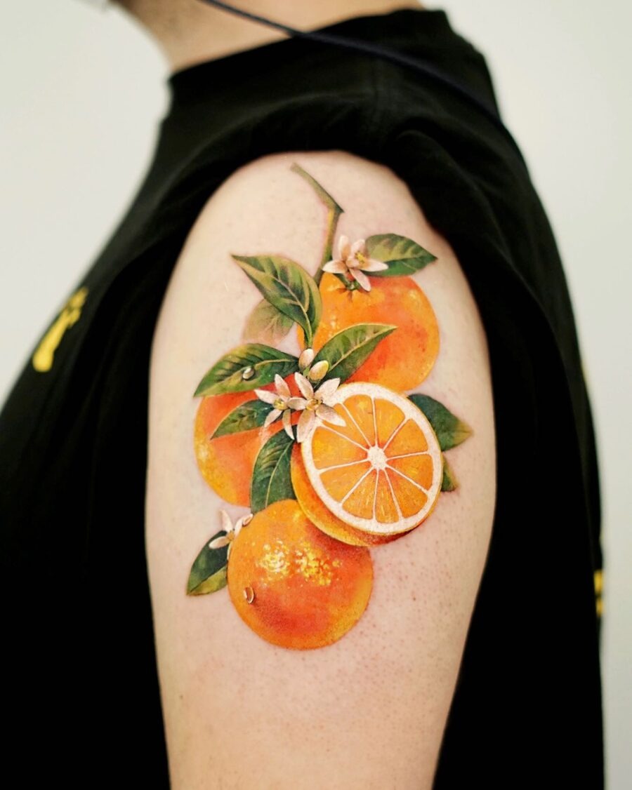 Vibrant orange tattoo with lush foliage Tattoo Design
