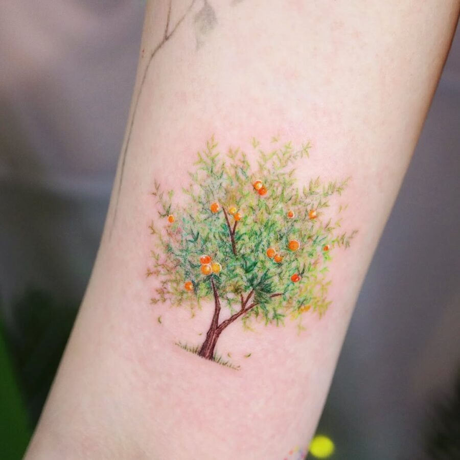 Vibrant orange tree tattoo symbolizing growth Tattoo Design