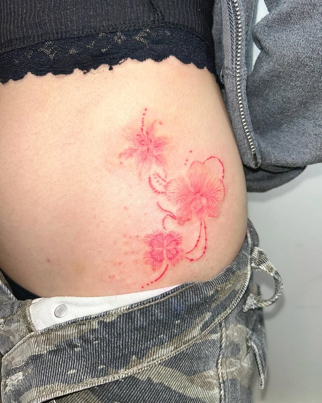 Delicate orchid tattoo with a romantic vibe Tattoo Design