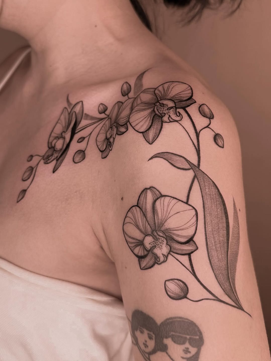 Elegant floral design embracing the shoulder Tattoo Design