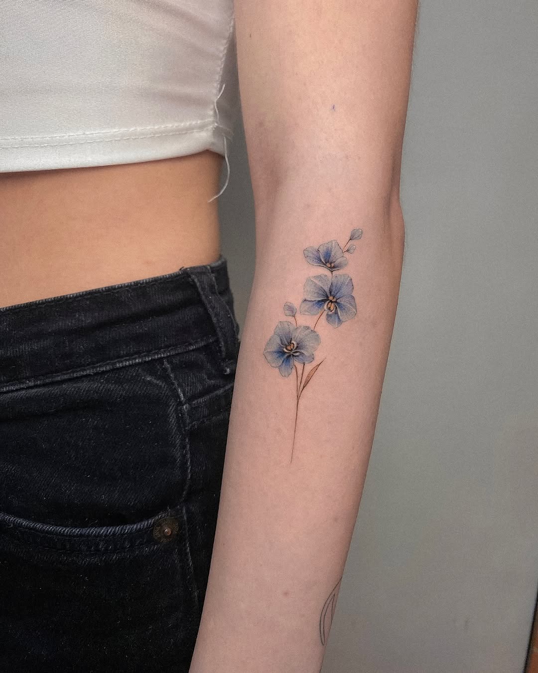 Elegant orchid tattoo design on the arm Tattoo Design