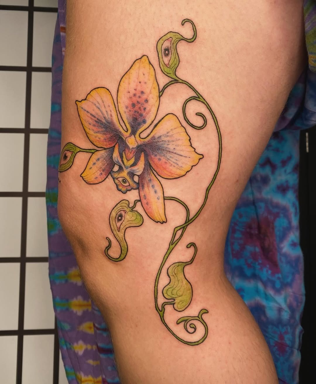 Elegant orchid tattoo design with vibrant colors Tattoo Design